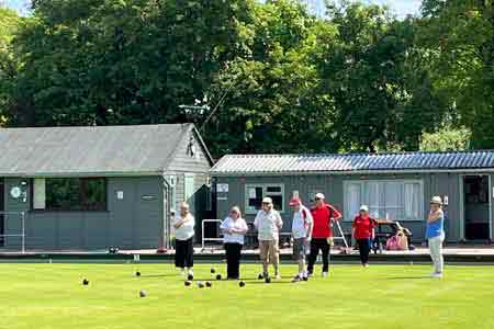 Bowlers being coached on the green
